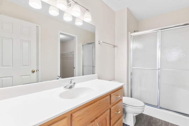 604 N Ellen St, Nixa, MO 65714 - bathroom featuring a shower stall, vanity, and a walk in closet