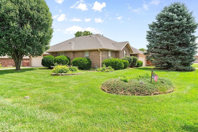 604 N Ellen St, Nixa, MO 65714 - view of side of property with a garage, brick siding, and a lawn