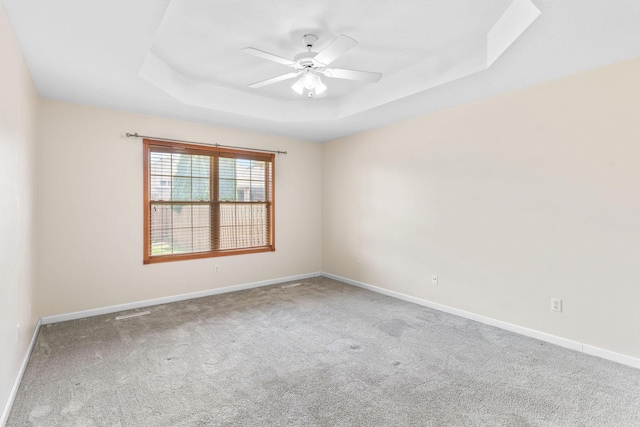 604 N Ellen St, Nixa, MO 65714 - spare room featuring a raised ceiling, ceiling fan, and carpet