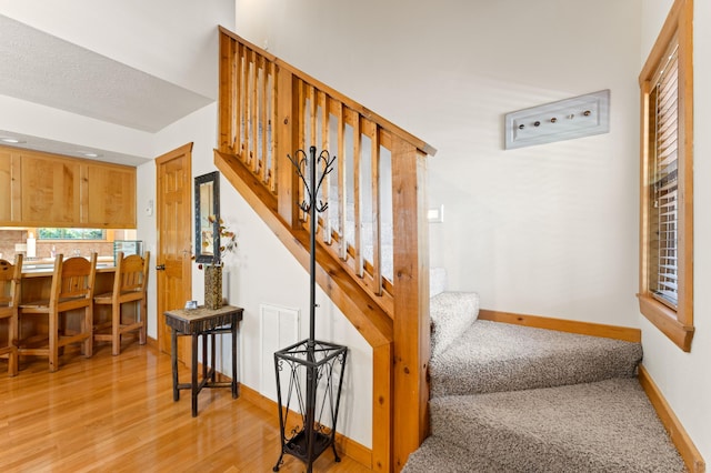 23 Olivia Ct Unit 103A, Branson West, MO 65737 - stairway featuring baseboards and wood finished floors