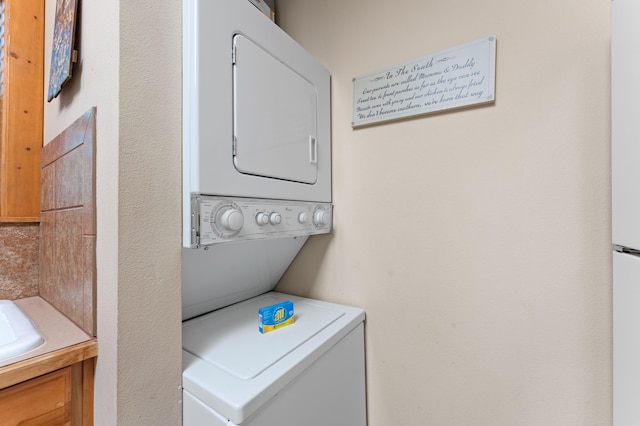 23 Olivia Ct Unit 103A, Branson West, MO 65737 - laundry room featuring estacked washer and dryer