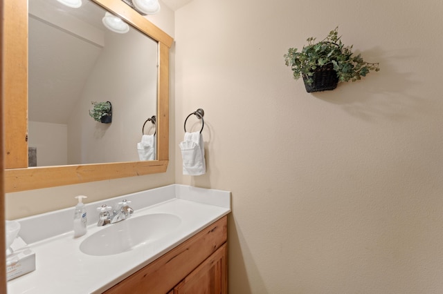 23 Olivia Ct Unit 103A, Branson West, MO 65737 - bathroom with vanity and lofted ceiling