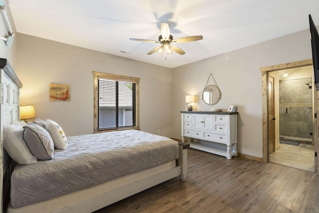 208 Jax Trl, Branson, MO 65616 - bedroom featuring wood finished floors, ceiling fan, and connected bathroom