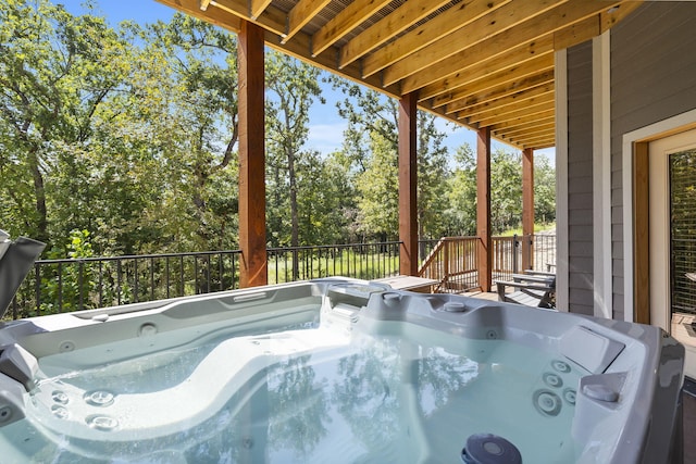 208 Jax Trl, Branson, MO 65616 - wooden terrace with a hot tub and view of wooded area