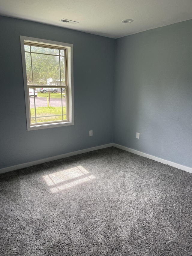 1506 6th St, Monett, MO 65708 - carpeted empty room with baseboards