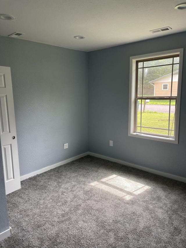 1506 6th St, Monett, MO 65708 - carpeted spare room featuring baseboards