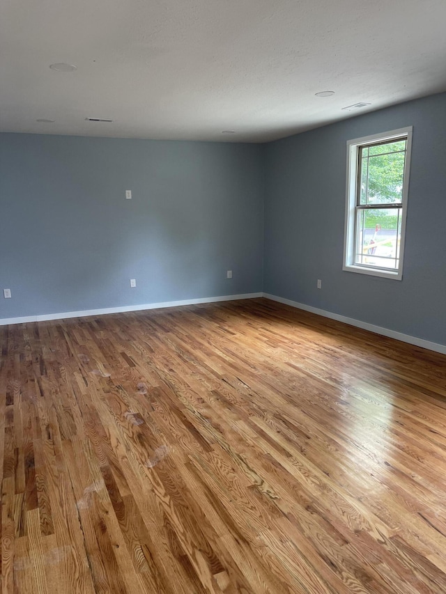 1506 6th St, Monett, MO 65708 - spare room with wood finished floors and baseboards