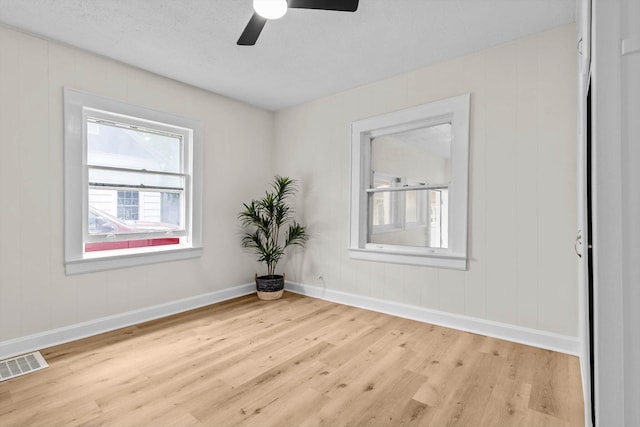 936 W Division St, Springfield, MO 65803 - unfurnished room featuring wood finished floors and a ceiling fan