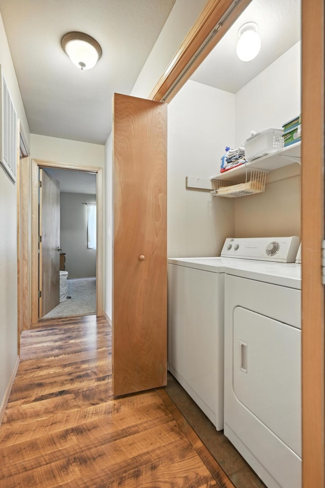 22562 Air Park Dr, Golden, MO 65658 - washroom with washing machine and clothes dryer and light wood-style flooring