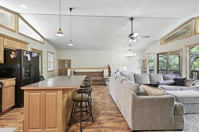 22562 Air Park Dr, Golden, MO 65658 - living room with light wood-type flooring, ceiling fan, a chandelier, and high vaulted ceiling