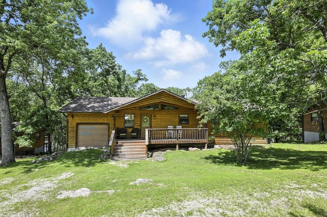 22562 Air Park Dr, Golden, MO 65658 - view of front of home featuring a garage, a front yard, and a wooden deck