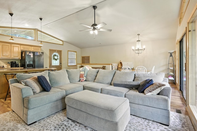 22562 Air Park Dr, Golden, MO 65658 - living room with light wood-style floors, lofted ceiling, a chandelier, and ceiling fan