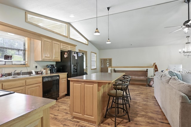 22562 Air Park Dr, Golden, MO 65658 - kitchen with black dishwasher, open floor plan, light brown cabinetry, light wood finished floors, and vaulted ceiling
