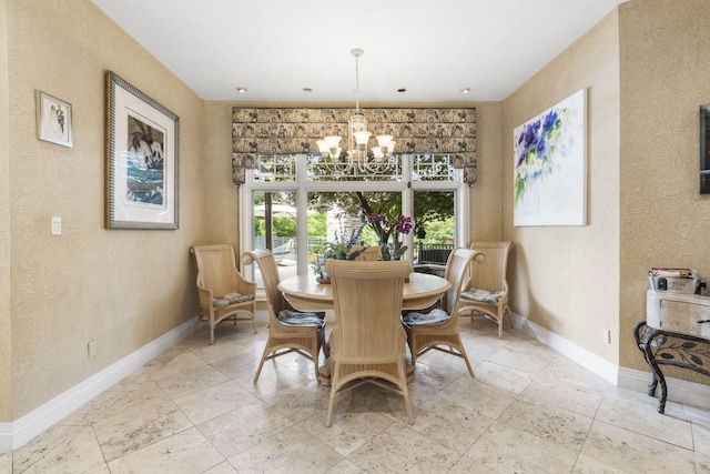 318 S Farm Rd Unit 193, Springfield, MO 65809 - dining space with a textured wall, a chandelier, and stone tile flooring