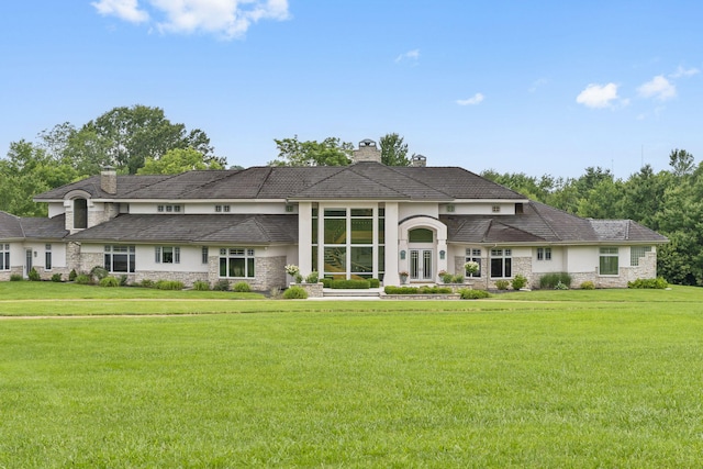 318 S Farm Rd Unit 193, Springfield, MO 65809 - view of front of home featuring a chimney, stucco siding, stone siding, and a front yard