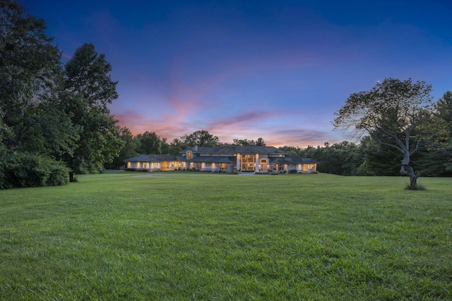 318 S Farm Rd Unit 193, Springfield, MO 65809 - yard at dusk with a lawn