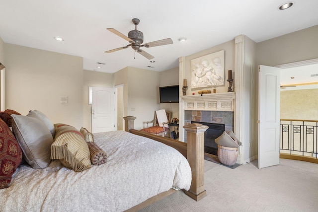 318 S Farm Rd Unit 193, Springfield, MO 65809 - carpeted bedroom featuring recessed lighting, a tile fireplace, and ceiling fan
