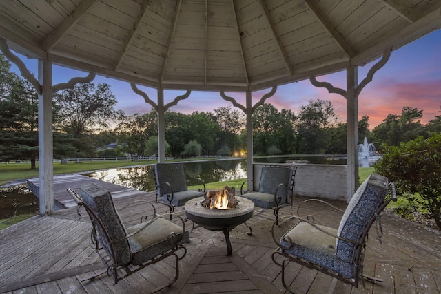 318 S Farm Rd Unit 193, Springfield, MO 65809 - deck with a fire pit, a gazebo, a water view, and view of scattered trees
