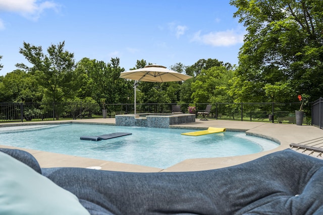 318 S Farm Rd Unit 193, Springfield, MO 65809 - view of swimming pool featuring view of wooded area, a pool with connected hot tub, and a patio area