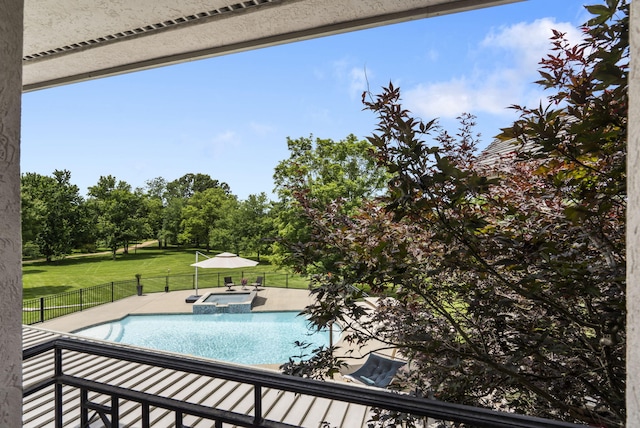318 S Farm Rd Unit 193, Springfield, MO 65809 - view of pool featuring a pool with connected hot tub, a patio, and view of wooded area