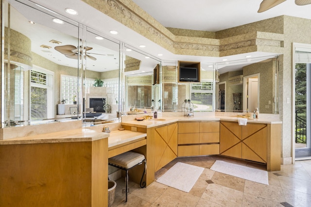 318 S Farm Rd Unit 193, Springfield, MO 65809 - bathroom featuring ceiling fan, vanity, recessed lighting, plenty of natural light, and a fireplace