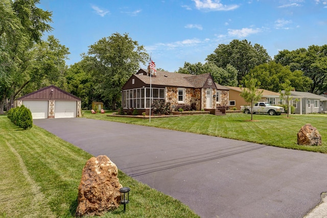 1841 E Dale St, Springfield, MO 65803 - single story home featuring stone siding, a garage, an outbuilding, and a front yard