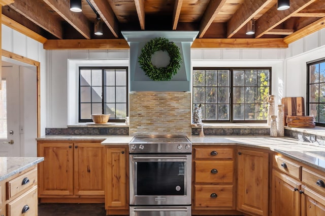 196 Lakeside Way, Forsyth, MO 65653 - kitchen with stainless steel electric stove, premium range hood, backsplash, light stone countertops, and a wood ceiling with exposed beams
