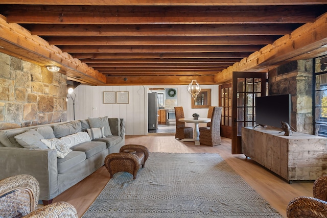 196 Lakeside Way, Forsyth, MO 65653 - living room featuring wood finished floors, beamed ceiling, and a chandelier