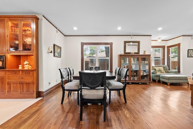 933 W Pershing St, Springfield, MO 65806 - dining area with wood finished floors, crown molding, and recessed lighting