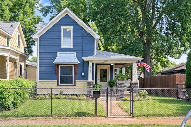 933 W Pershing St, Springfield, MO 65806 - view of front of home featuring a porch, a gate, and a fenced front yard