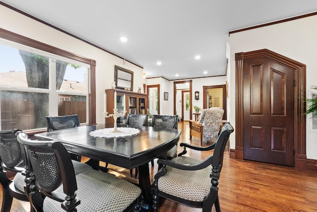933 W Pershing St, Springfield, MO 65806 - dining room with light wood-style flooring, recessed lighting, and ornamental molding