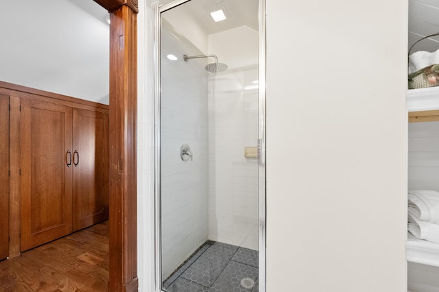 933 W Pershing St, Springfield, MO 65806 - bathroom featuring a stall shower and wood finished floors