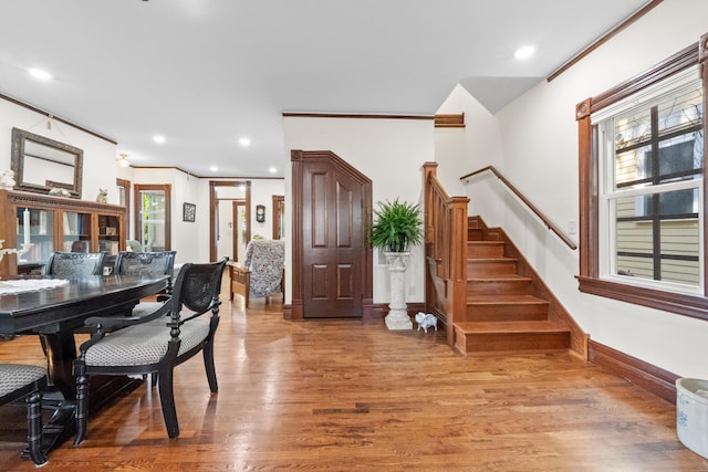 933 W Pershing St, Springfield, MO 65806 - dining area with wood finished floors, stairway, recessed lighting, and crown molding