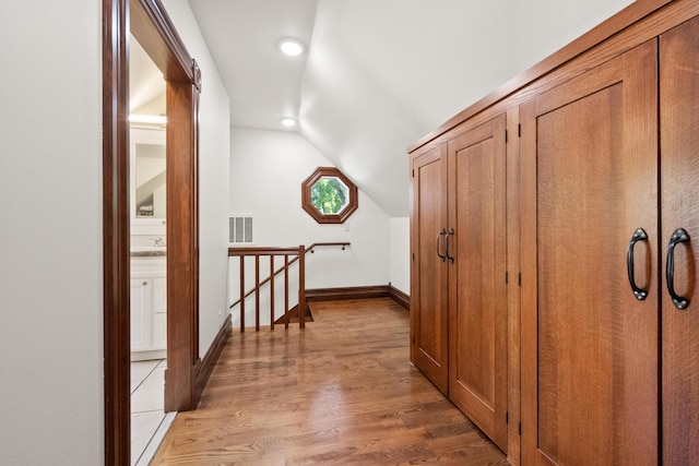 933 W Pershing St, Springfield, MO 65806 - corridor featuring an upstairs landing, lofted ceiling, light wood-style floors, and recessed lighting