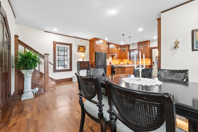 933 W Pershing St, Springfield, MO 65806 - dining space with recessed lighting, wood finished floors, and stairway