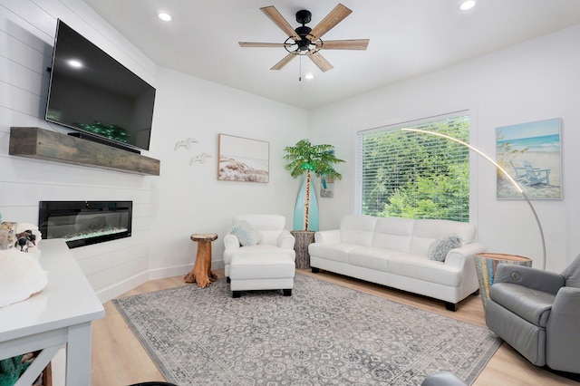 653 W Arbor Glenn Dr, Nixa, MO 65714 - living room featuring light wood-style flooring, ceiling fan, recessed lighting, and a large fireplace