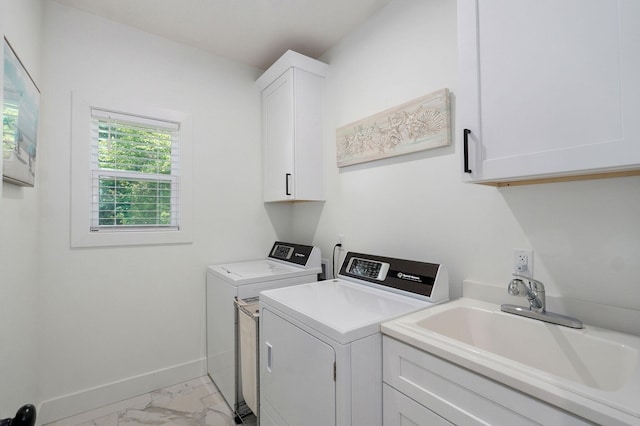 653 W Arbor Glenn Dr, Nixa, MO 65714 - washroom featuring cabinet space, light marble finish floors, and independent washer and dryer