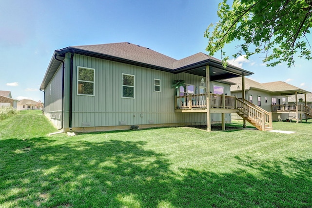 653 W Arbor Glenn Dr, Nixa, MO 65714 - rear view of property featuring roof with shingles, a lawn, stairway, a deck, and board and batten siding