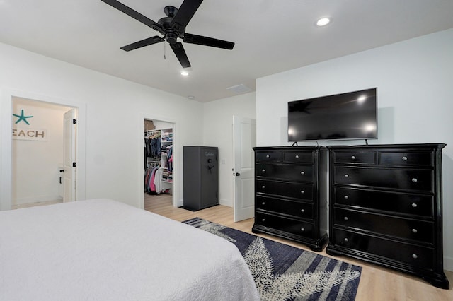 653 W Arbor Glenn Dr, Nixa, MO 65714 - bedroom featuring light wood finished floors, a spacious closet, a closet, recessed lighting, and a ceiling fan