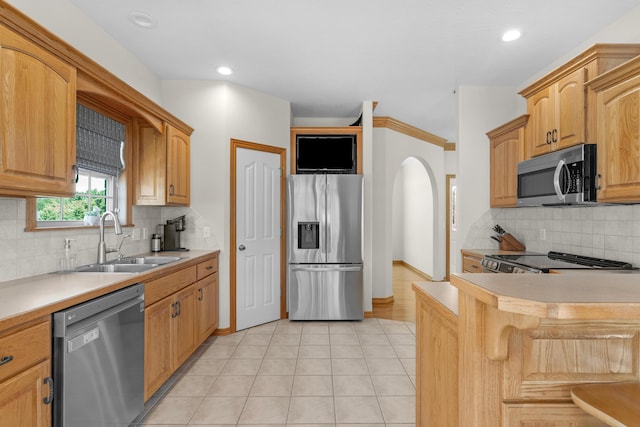 1190 E Headley St, Springfield, MO 65803 - kitchen with stainless steel appliances, light countertops, tasteful backsplash, light tile patterned floors, and recessed lighting