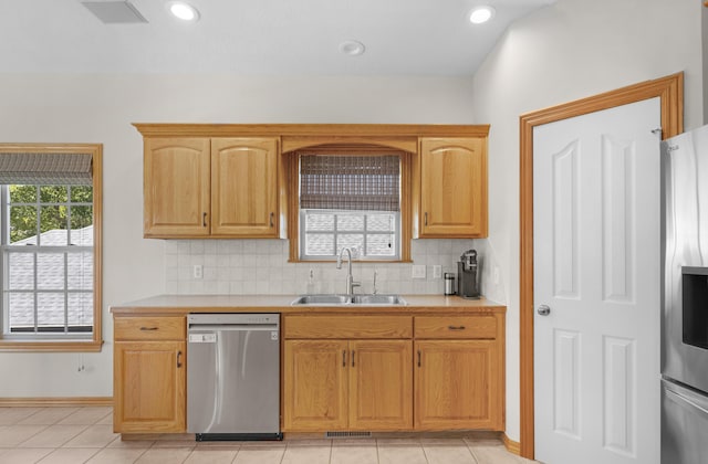 1190 E Headley St, Springfield, MO 65803 - kitchen with appliances with stainless steel finishes, light countertops, backsplash, light tile patterned flooring, and recessed lighting