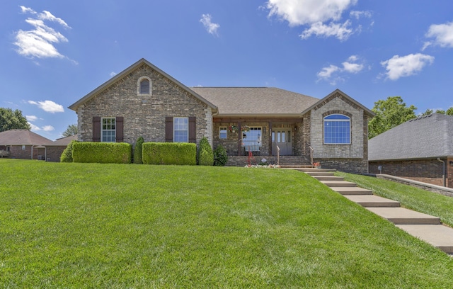 1190 E Headley St, Springfield, MO 65803 - view of front of home with a front yard, covered porch, and stone siding