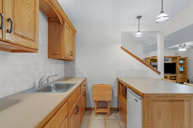1190 E Headley St, Springfield, MO 65803 - kitchen with tasteful backsplash, a peninsula, light countertops, and light tile patterned floors