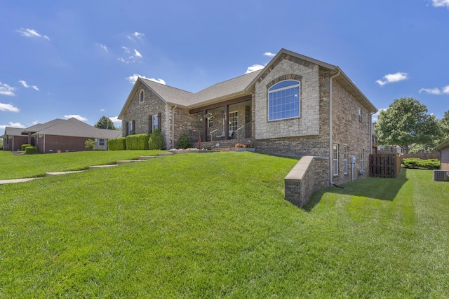 1190 E Headley St, Springfield, MO 65803 - ranch-style home with stone siding and a front yard