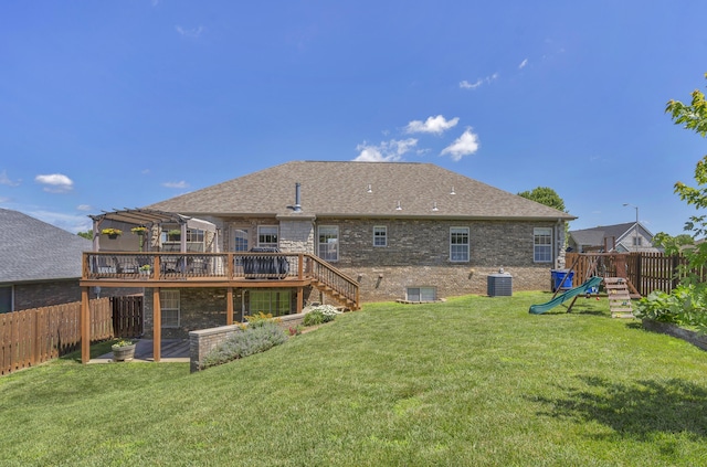 1190 E Headley St, Springfield, MO 65803 - back of property with a deck, a playground, a fenced backyard, stairs, and a pergola