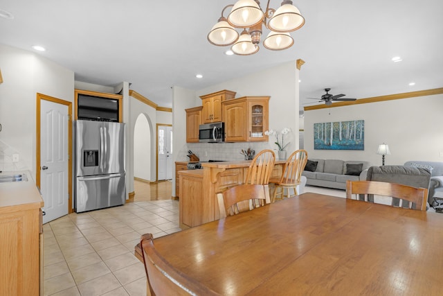 1190 E Headley St, Springfield, MO 65803 - dining area featuring a chandelier, ceiling fan, light tile patterned floors, crown molding, and recessed lighting