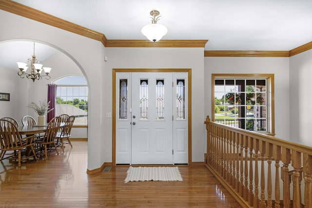 1190 E Headley St, Springfield, MO 65803 - foyer entrance with a chandelier, wood finished floors, and crown molding