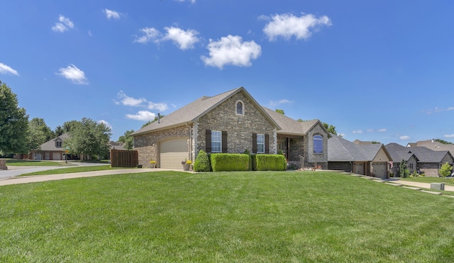 1190 E Headley St, Springfield, MO 65803 - view of front of home with driveway, stone siding, an attached garage, a front lawn, and brick siding