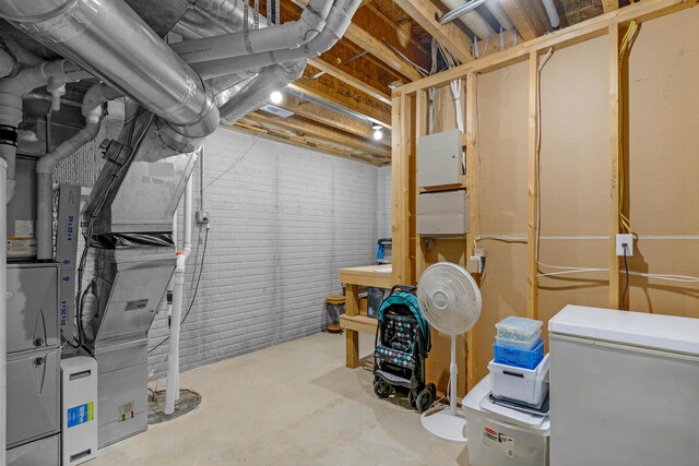 1190 E Headley St, Springfield, MO 65803 - unfinished below grade area featuring fridge and heating unit
