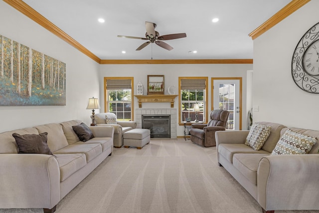 1190 E Headley St, Springfield, MO 65803 - living area featuring recessed lighting, ceiling fan, ornamental molding, a tile fireplace, and light colored carpet